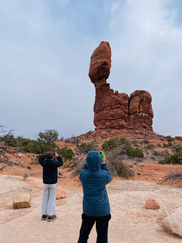 Taking a picture of Balancing Rock at Arches NP